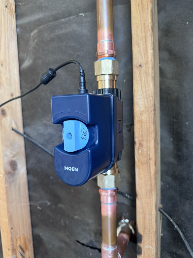 Moen smart automatic water leak detection and shutoff valve installed on a home's main copper water line